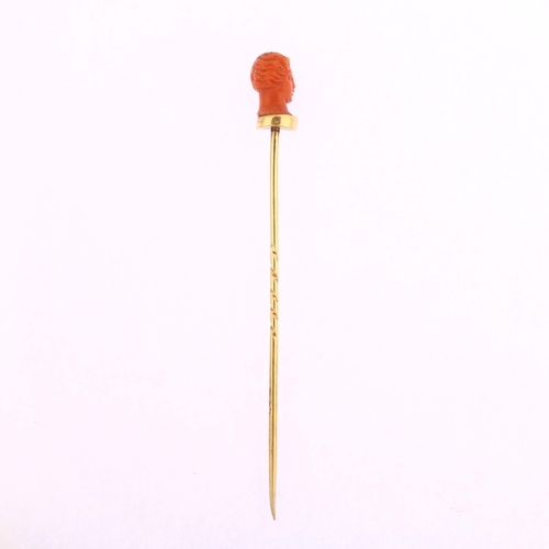 1122 - An Italian 19th century coral head stickpin, circa 1870, unmarked gold settings, head height 11.7mm,... 