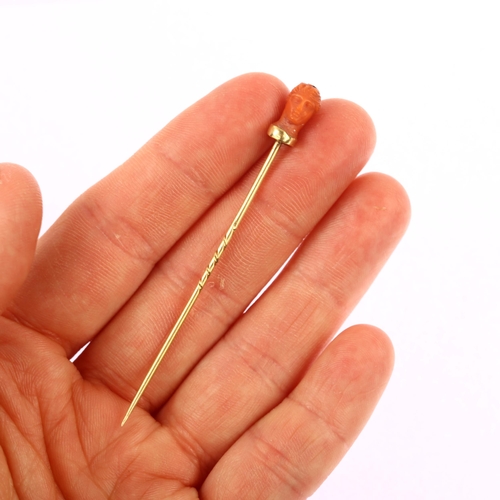 1122 - An Italian 19th century coral head stickpin, circa 1870, unmarked gold settings, head height 11.7mm,... 