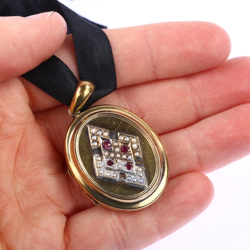 1127 - A Victorian ruby and pearl photo locket pendant, circa 1880, unmarked yellow metal settings with app... 