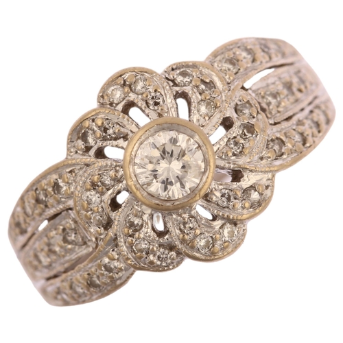 1134 - A modern 18ct white gold diamond flowerhead ring, set with modern round brilliant-cut diamonds, tota... 