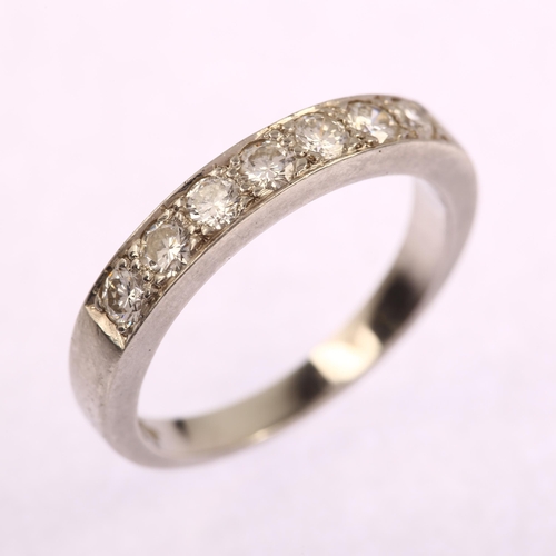 1135 - A platinum seven stone diamond half eternity ring, prong set with modern round brilliant-cut diamond... 