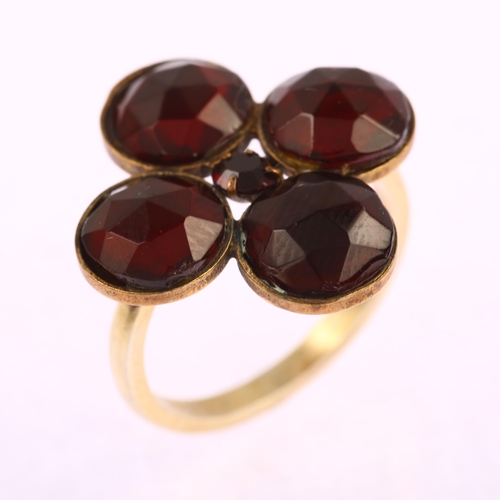 1137 - A large Victorian Bohemian garnet quatrefoil ring, unmarked yellow metal closed-back settings, with ... 