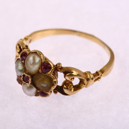 1139 - A Victorian ruby and pearl cluster ring, unmarked gold settings, with openwork foliate shoulders, se... 