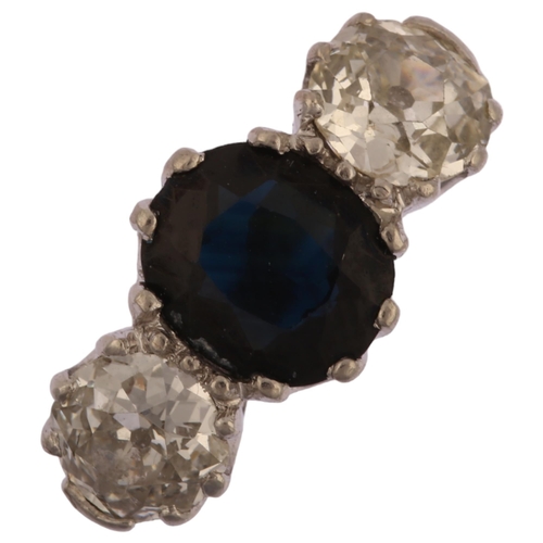 1149 - A late 20th century 18ct gold three stone sapphire and diamond ring, prong set with 1.25ct oval mixe... 