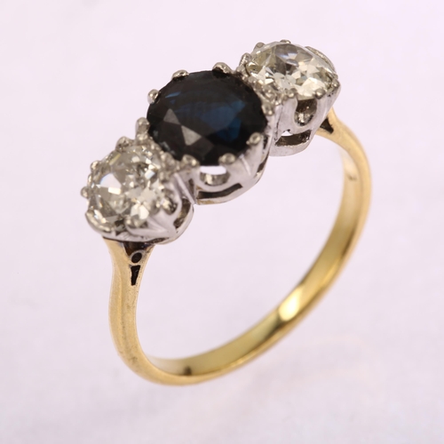 1149 - A late 20th century 18ct gold three stone sapphire and diamond ring, prong set with 1.25ct oval mixe... 