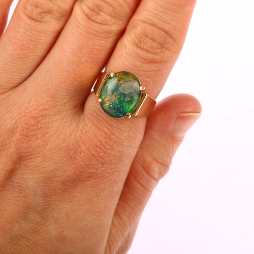 1150 - A late 20th century 14ct gold opal triplet ring, setting height 14.7mm, size P, 9.1g