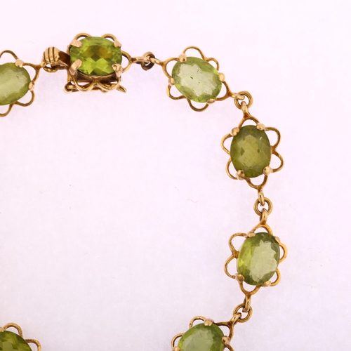 1151 - A late 20th century 9ct gold peridot line bracelet, each flowerhead panel set with an oval mixed-cut... 