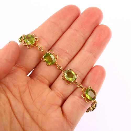 1151 - A late 20th century 9ct gold peridot line bracelet, each flowerhead panel set with an oval mixed-cut... 