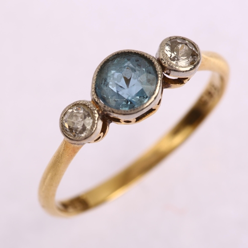 1163 - An early 20th century 18ct gold three stone aquamarine and diamond ring, bezel set with round-cut aq... 