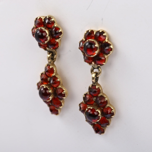 1165 - A pair of late 20th century 9ct gold garnet drop earrings, set with round cabochon and faceted garne... 