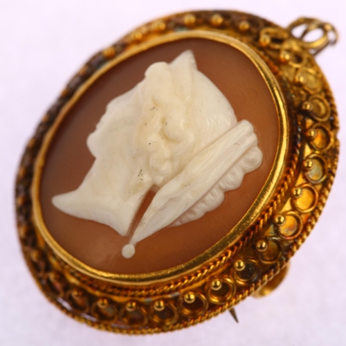 1175 - A Victorian shell cameo brooch, relief carved depicting Classical female profile, in unmarked gold E... 