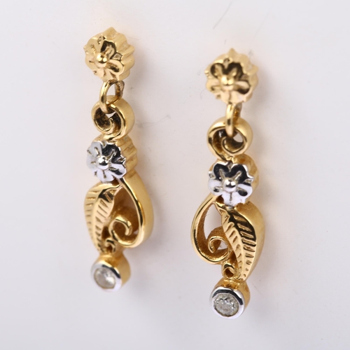 1176 - A pair of 18ct gold diamond floral drop earrings, with stud fittings, total diamond content approx 0... 