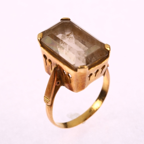 1178 - A late 20th century smoky quartz dress ring, unmarked gold settings with rectangular step-cut quartz... 