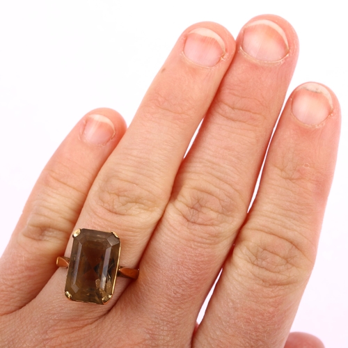 1178 - A late 20th century smoky quartz dress ring, unmarked gold settings with rectangular step-cut quartz... 