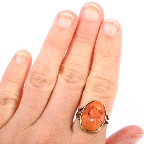 1188 - A 9ct gold coral habille cameo ring, relief carved depicting figure with a pearl necklace, setting h... 