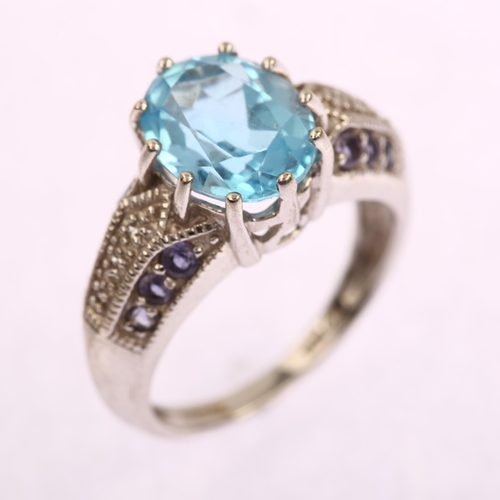 1190 - A modern Thai 9ct white gold blue topaz tanzanite and diamond ring, setting height 10.8mm, size L, 4... 