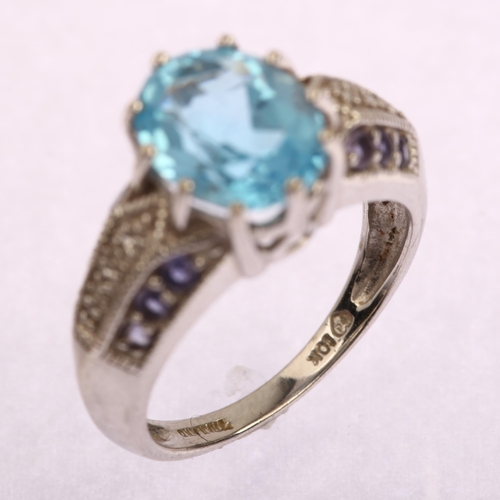 1190 - A modern Thai 9ct white gold blue topaz tanzanite and diamond ring, setting height 10.8mm, size L, 4... 