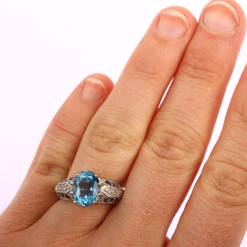 1190 - A modern Thai 9ct white gold blue topaz tanzanite and diamond ring, setting height 10.8mm, size L, 4... 