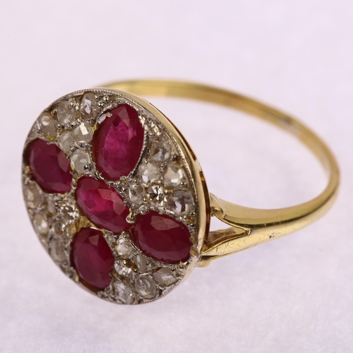 1198 - A late 20th century ruby and diamond circular cluster ring, unmarked 18ct gold settings with oval mi... 