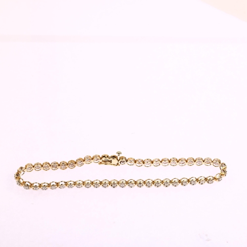 1199 - A modern 9ct gold diamond tennis line bracelet, prong set with single-cut diamonds, total diamond co... 