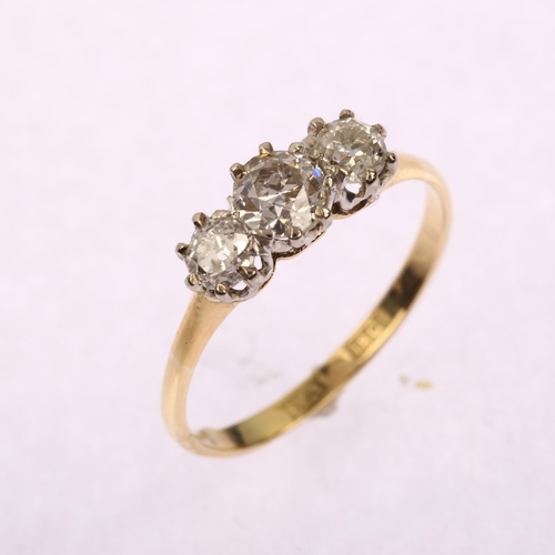 1201 - An early 20th century 18ct gold three stone diamond ring, set with old European-cut diamonds, total ... 