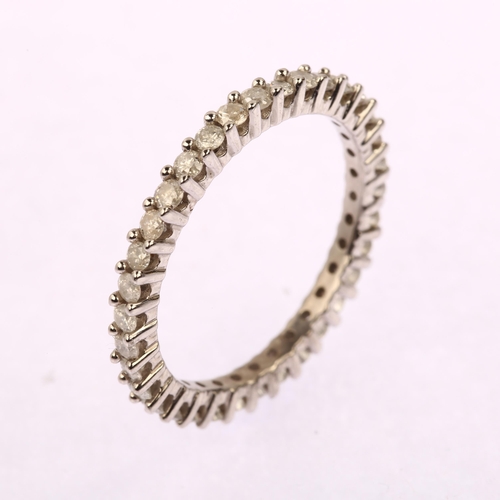 1202 - A modern 9ct white gold diamond full eternity ring, prong set with modern round brilliant-cut diamon... 