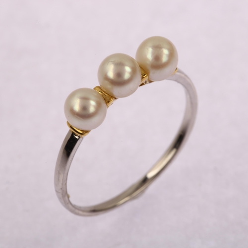 1203 - A modern 18ct white gold three stone pearl ring, pearl diameter 4.7mm, size O, 1.7g