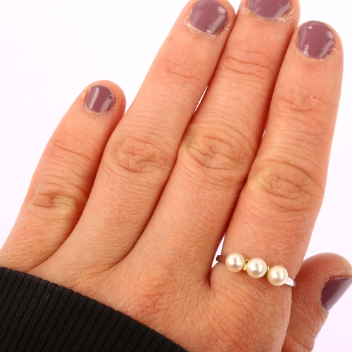 1203 - A modern 18ct white gold three stone pearl ring, pearl diameter 4.7mm, size O, 1.7g