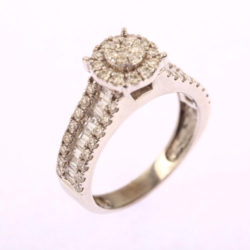 1205 - A modern 14ct white gold diamond halo cluster ring, pave set with modern round brilliant-cut diamond... 