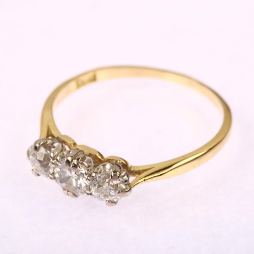 1214 - An early 20th century 18ct gold three stone diamond ring, claw set with old-cut diamonds, total diam... 