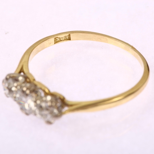 1214 - An early 20th century 18ct gold three stone diamond ring, claw set with old-cut diamonds, total diam... 