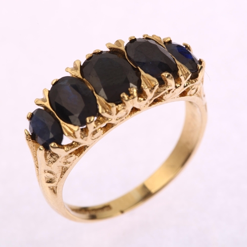 1216 - A late 20th century 9ct gold graduated five stone sapphire half hoop ring, set with oval mixed-cut s... 