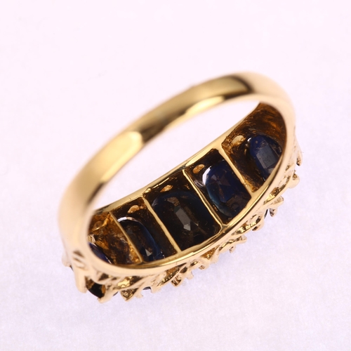 1216 - A late 20th century 9ct gold graduated five stone sapphire half hoop ring, set with oval mixed-cut s... 