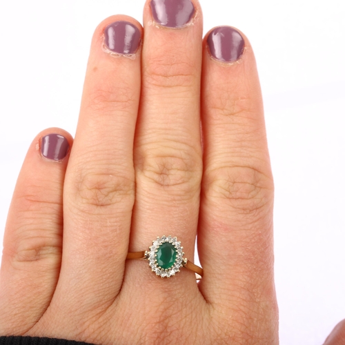 1224 - A modern 9ct gold emerald and diamond oval cluster ring, set with oval mixed-cut emerald and single-... 