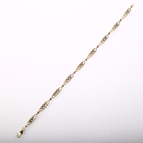 1225 - A modern 9ct gold diamond Celtic knot bracelet, length 19cm, 5.7g