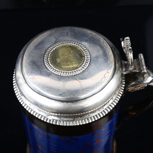 1497 - An 18th century Scandinavian silver-mounted lustre ware lidded tankard, with coin inset lid, maker's... 