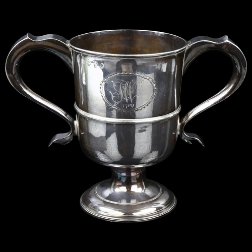 1498 - A large George III silver 2-handled pedestal trophy cup, with contemporary copper lined base, by Joh... 