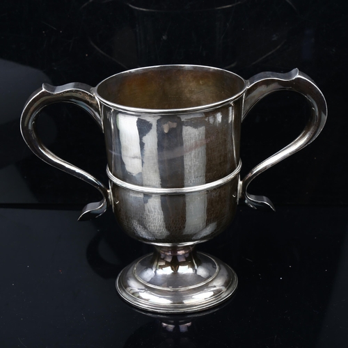 1498 - A large George III silver 2-handled pedestal trophy cup, with contemporary copper lined base, by Joh... 