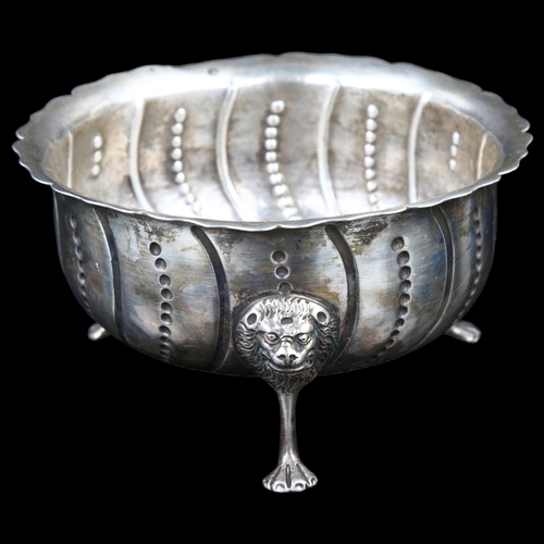 1501 - A George III Irish silver sugar basin, relief embossed spiral decoration with lion mask feet, maker'... 