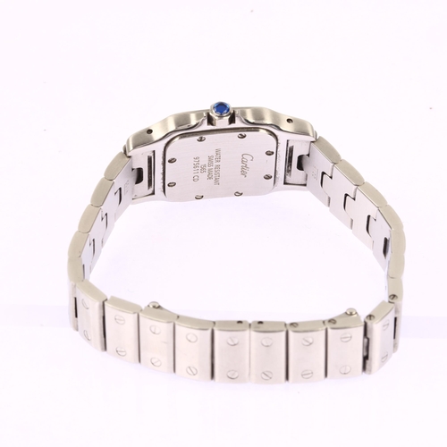 1030 - CARTIER - a stainless steel Santos quartz bracelet watch, ref. 1565, circa 2004, silvered dial with ... 