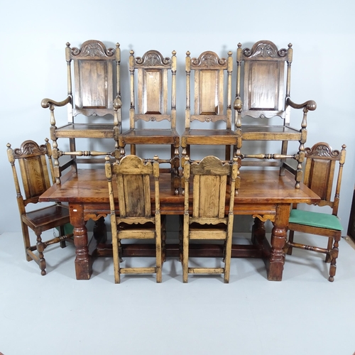 2050 - An antique oak oak plank top dining table, possibly by Titchmarsh and Godwin, with breadboard ends, ... 