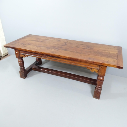 2050 - An antique oak oak plank top dining table, possibly by Titchmarsh and Godwin, with breadboard ends, ... 