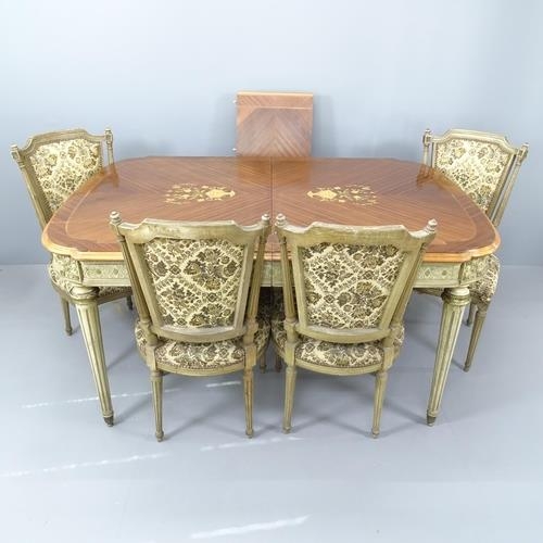 2280 - An ornate French walnut and kingwood dining table, with inlaid floral decoration on carved and paint... 