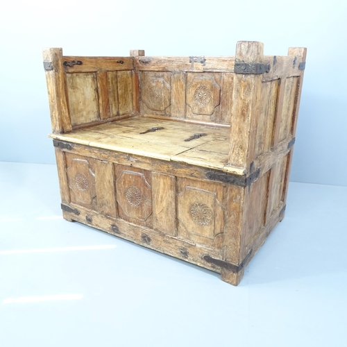 2055 - A Tibetan hardwood and metal bound Damchiya Hope Chest chair, with panelled decoration and lifting s... 