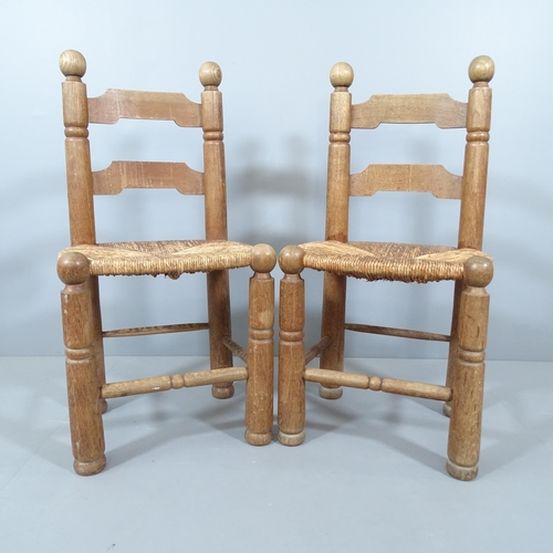 2058 - Attributed to Charles Dudouyt, a pair of mid-century French brutalist oak side chairs with flared le... 