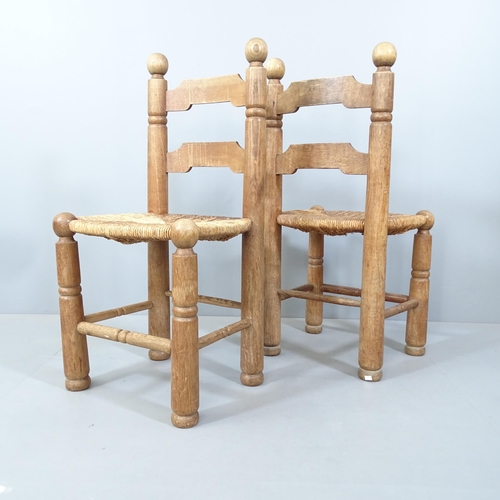 2058 - Attributed to Charles Dudouyt, a pair of mid-century French brutalist oak side chairs with flared le... 