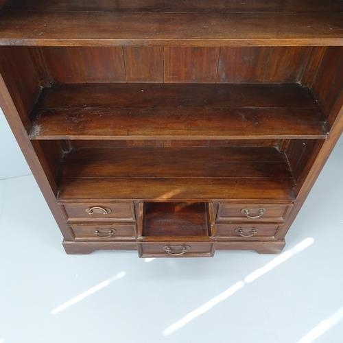 2069 - A tall mahogany open bookcase with three fixed shelves and six drawers below. 124x189x37cm