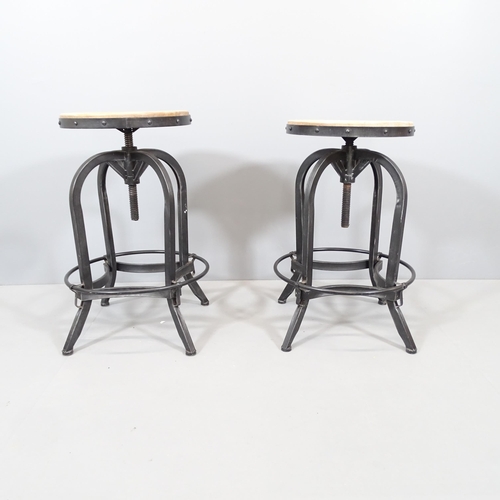 2082 - A pair of modern industrial style stools with rise and fall mechanism. Height (lowest) 69cm