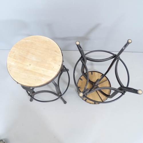 2082 - A pair of modern industrial style stools with rise and fall mechanism. Height (lowest) 69cm