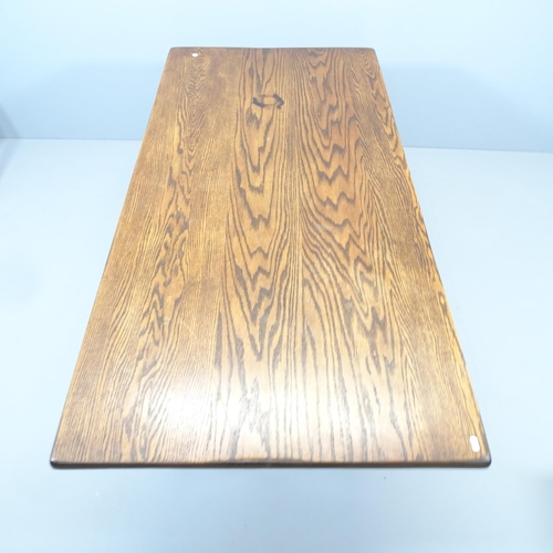 2084 - A stained pine trestle dining table, with heart cut-out decoration. 165x76x80cm.